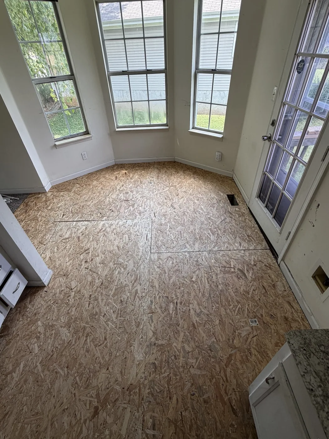 OSB subfloor in windowed dining nook
